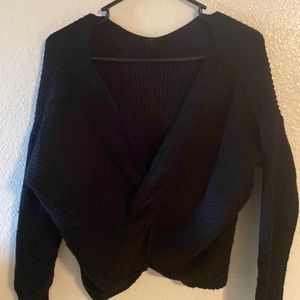 Women's small, long-sleeve, slightly cropped length, twist front, black sweater.